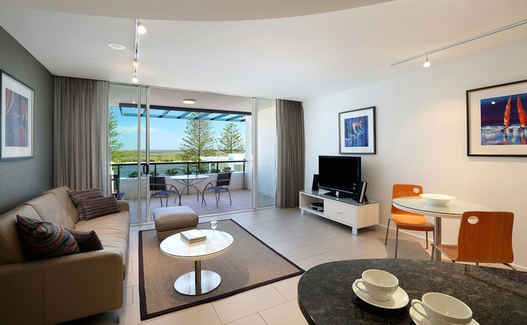 Slick modern apartment with terrace, flatscreen tv and wall art at Rumba Resort