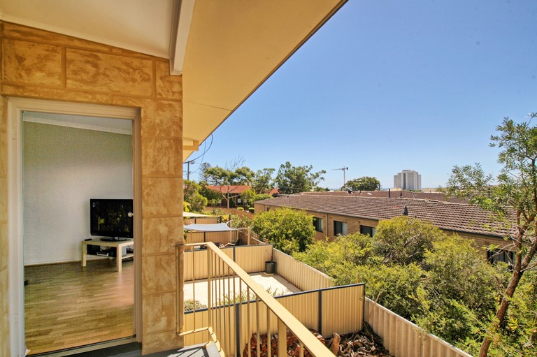 View of surrounding buildings and foliage from balcony at Acacia Holiday or Business Stay Accommodation in Perth