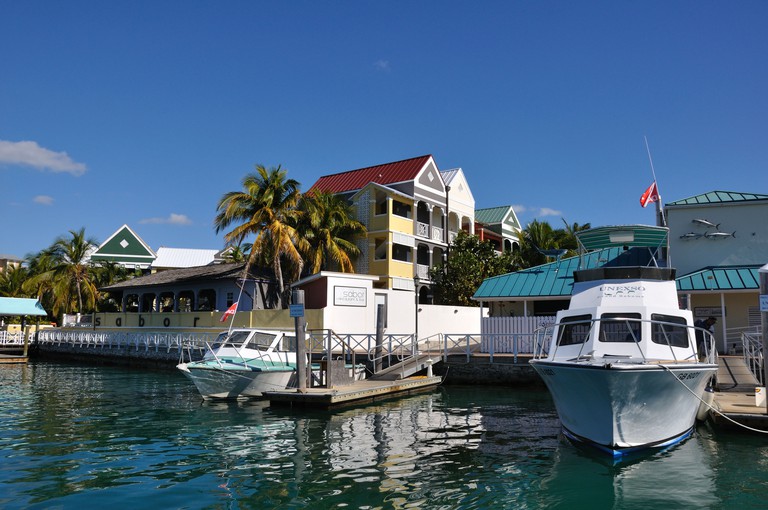 The exterior of Sabor as seen across Freeport Marina, where two boats are moored