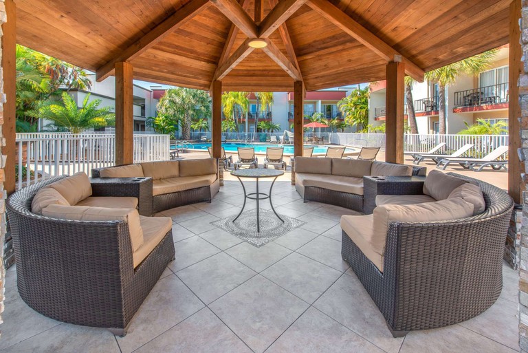A sheltered sitting area with pool views at La Quinta Inn by Wyndham Clearwater Central