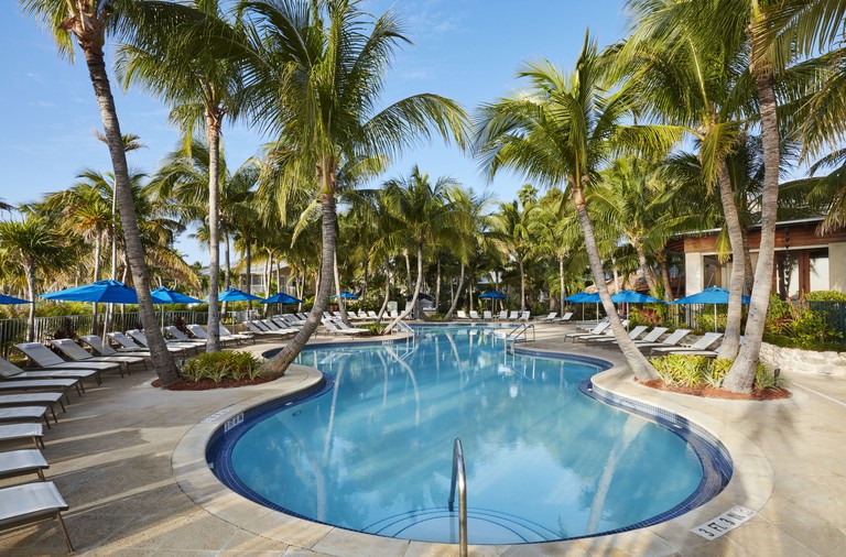 The lagoon-style pool rimmed by palm trees and lounge chairs at Cheeca Lodge and Spa on Islamorada in the Florida Keys