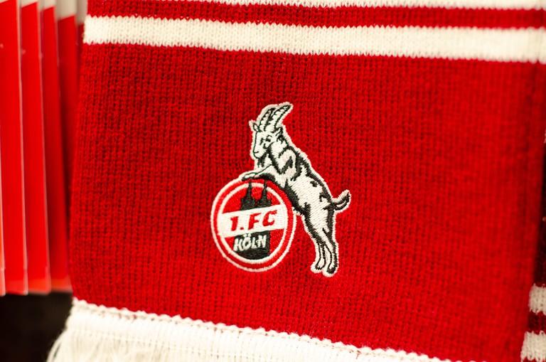 A red 1. FC Köln (or FC Cologne) scarf in close-up