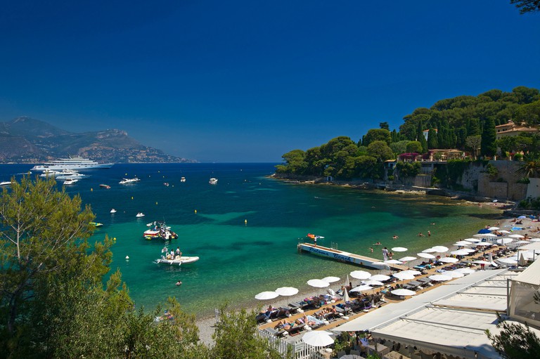 France Europe South of France Cote d'Azur – Boats off the sandy busy beach of Plage Paloma near Saint Jean Cap Ferrat