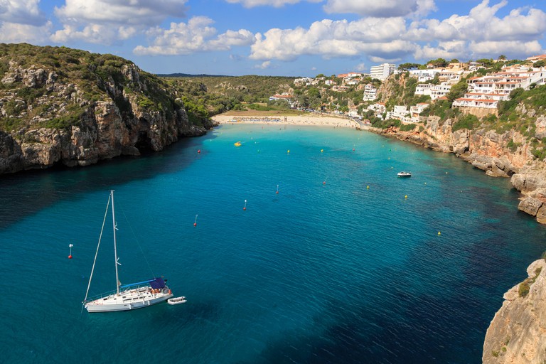 Boats moored near Cala en Porter beach, Menorca, Balearic Islands, Spain