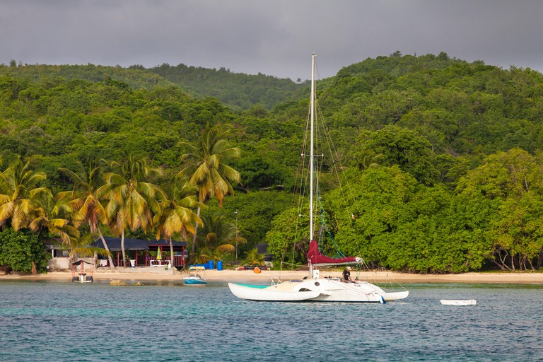 Beach bar with sailing boat on the shore in Marie Galante, Guadeloupe