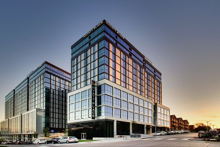 With floor-to-ceiling glass windows, the Hyatt Place Iowa City Downtown stands tall on the corner of East Court Street