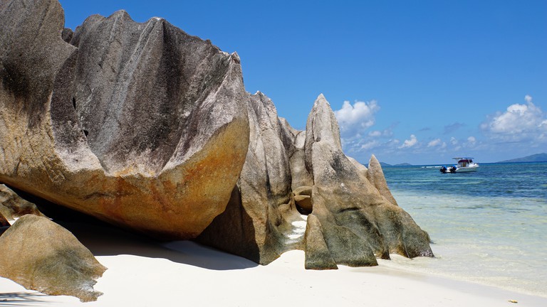 Rugged rocks on a tropical beach on Curieuse island, in the Seychelles