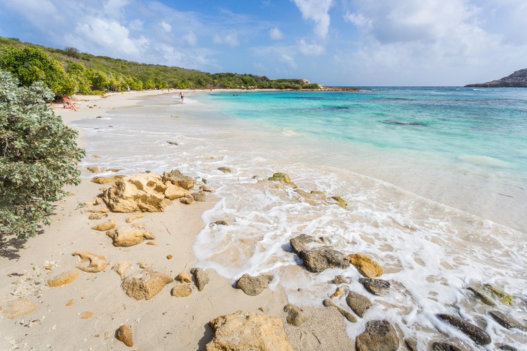A beautiful, unspoilt, sandy beach and turquoise sea in Half Moon Bay, Antigua, Antigua and Barbuda, West Indies