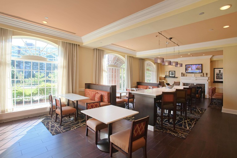 The elegant dining area of the Hampton Inn and Suites Stamford