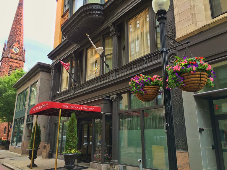 Street view of the beautifully preserved late-1800s building housing the Hotel Providence