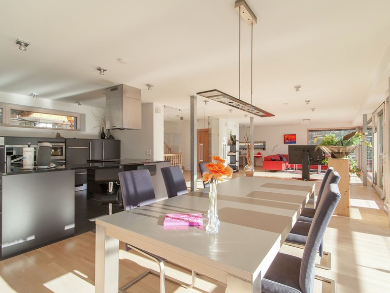 The sprawling, modern kitchen, dining and living area in Lavish Villa on an Exclusive Mountain in Weissensee, Austria