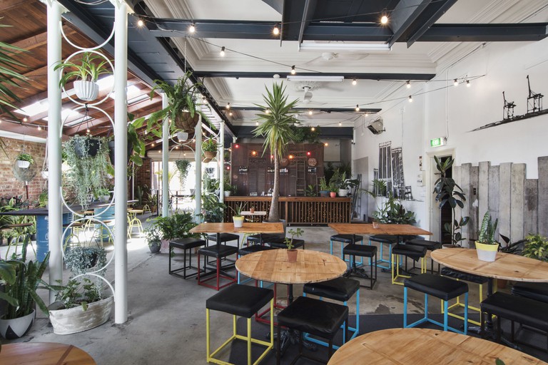 Laid-back stylish outdoor dining area with plants at the Local in Fremantle, Perth