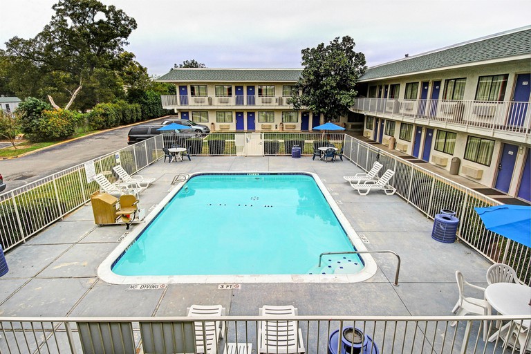 The outdoor pool area at Motel 6 San Marcos