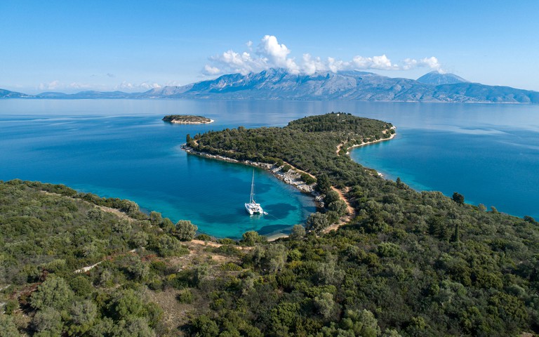 Aerial view of a catamaran moored in a small bay in Kefalonia