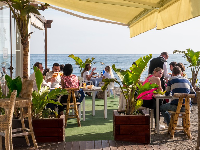 Alfresco outdoor beach bar restaurant & diners San Pedro de Alcantara Malaga Costa del Sol Spain