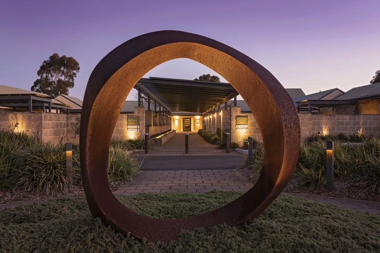 Large circular sculpture frames covered walkway to the Louise, Barossa Valley