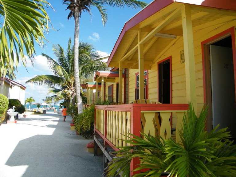 The brightly colored cottages at Tropical Paradise Hotel just steps from the beach