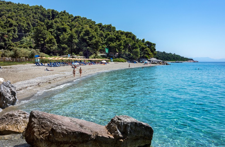 Revellers enjoy Kastani Beach, Skopelos, Northern Sporades, Greece