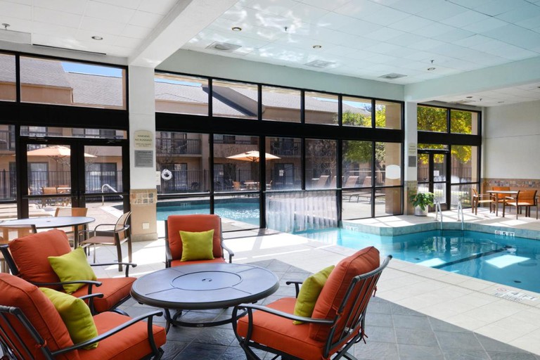 The pool at Courtyard by Marriott Dallas Arlington/Entertainment District, which leads outside of the building