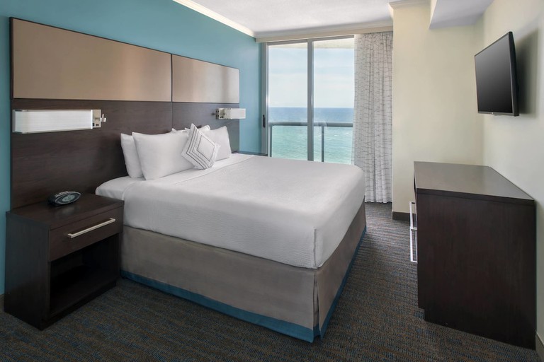 Double room with a view and wooden furniture at Residence Inn Fort Lauderdale Pompano Beach
