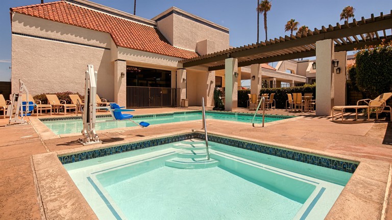 Sunny pool and jacuzzi area at Best Western Plus Big America in Santa Maria, California