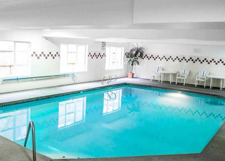 Indoor pool area at Comfort Suites Southwest, with two handrails