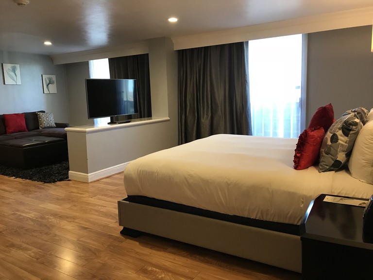 A spacious red-and-gray room at the DoubleTree by Hilton Hotel Midland Plaza