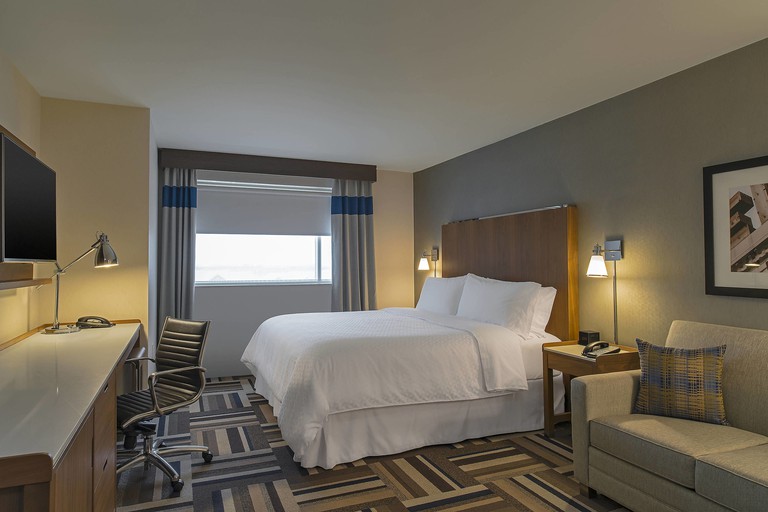 A contemporary blue-and-gray room at the Four Points by Sheraton Midland