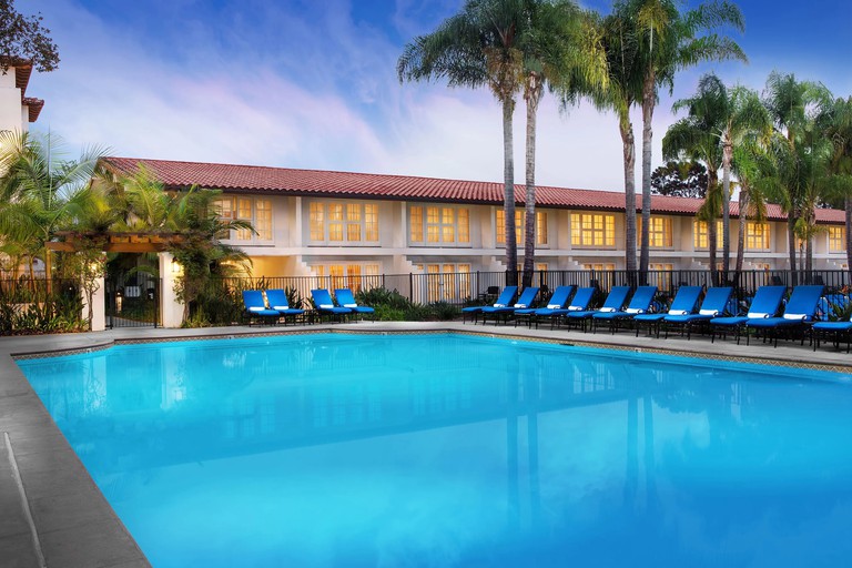 Pool at the Omni La Costa Resort & Spa, lined with blue sun loungers