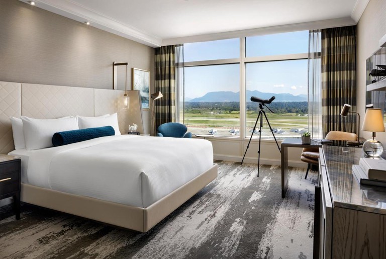 Bedroom with mountain views at the Fairmont Vancouver Airport In-Terminal Hotel