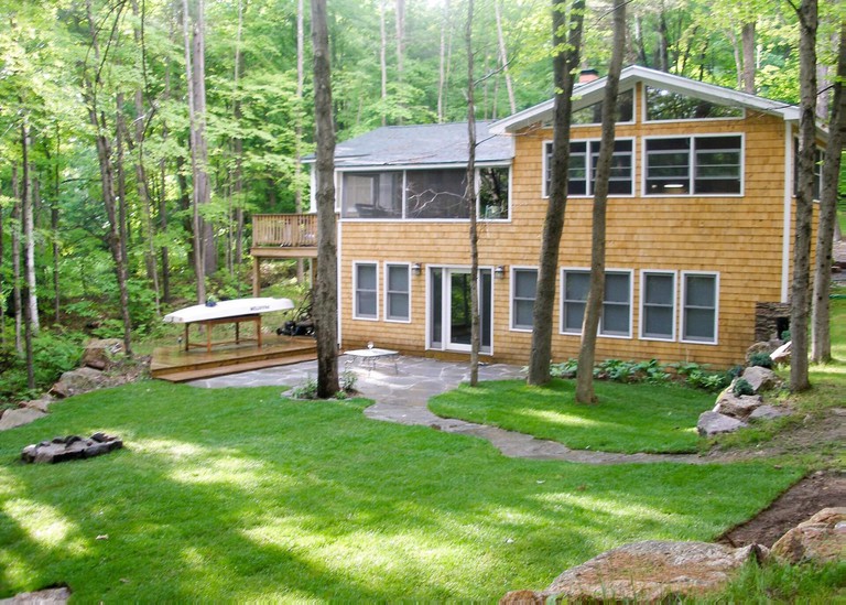 The two-story Lake Winona – Waterfront – 391 surrounded by the woods