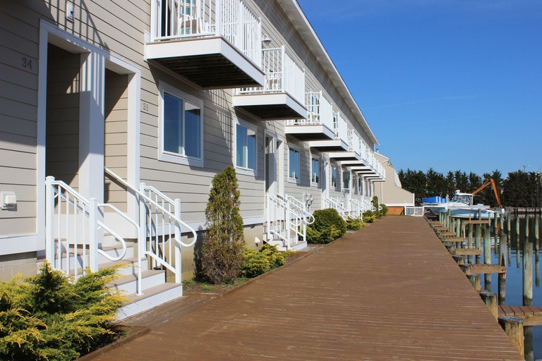 Row of condos with balconies facing the bay at Ocean High by Capital Vacations in Ocean City, Maryland