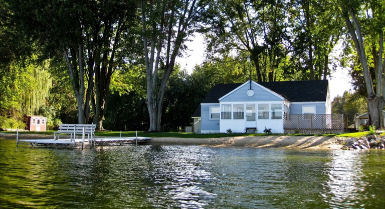 On Pointe Lakefront Resort exterior with water and trees