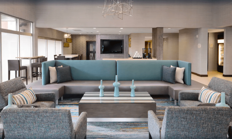 Living room at Residence Inn Dallas Plano/The Colony with blue and beige decor