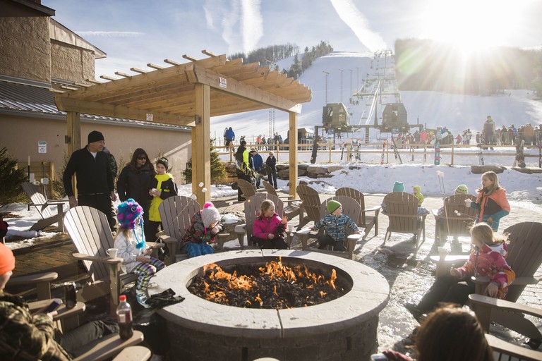 The outdoor firepit and seating area at Wisp Resort