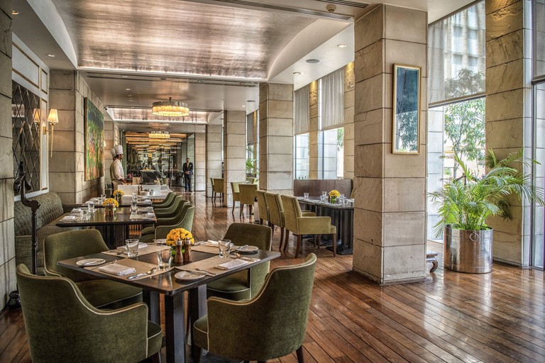Dark-wood tables, stylish marble walls and two chefs at Indian Accent